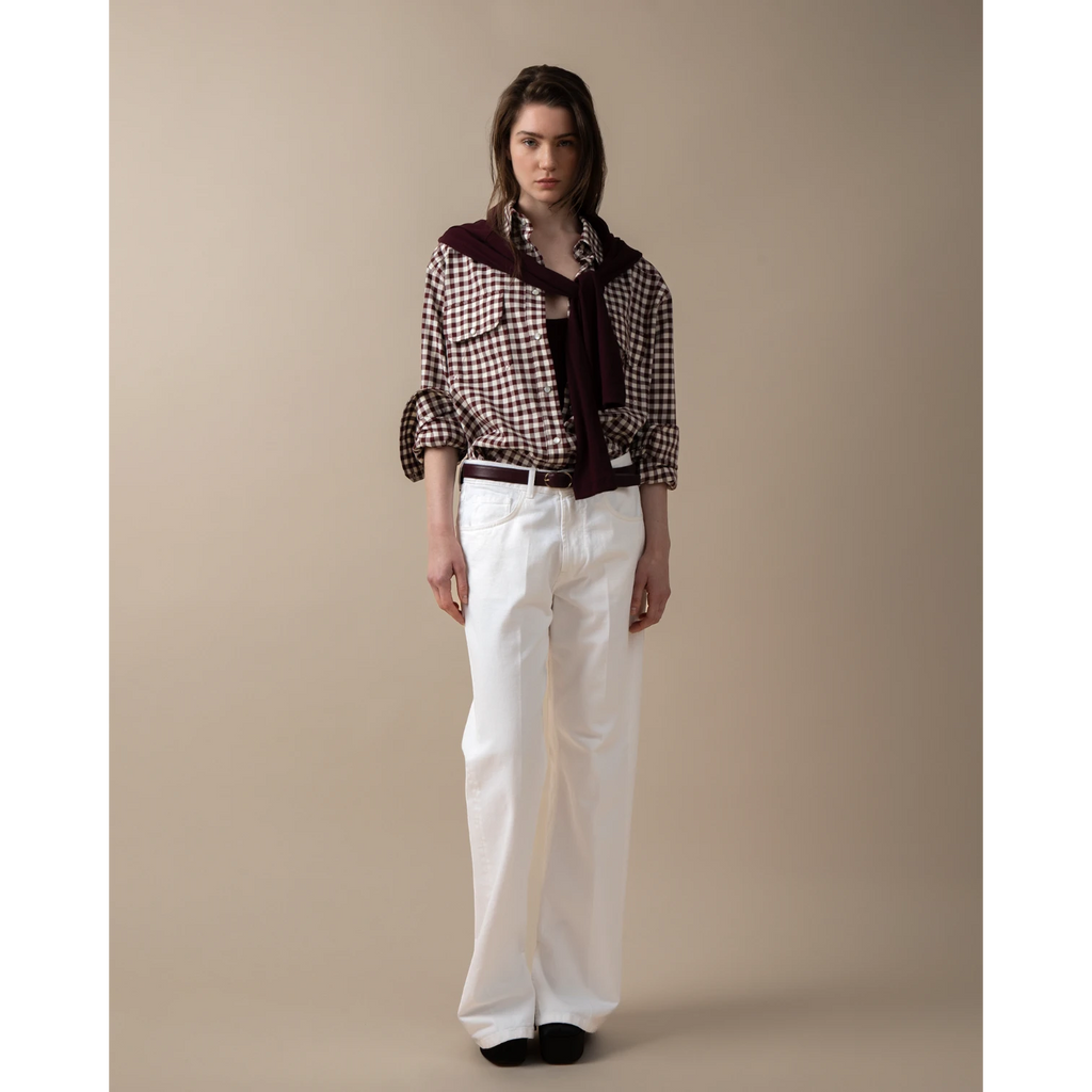 Maison Sarava women's oversized brown and white gingham western shirt with pointed collar, flap pockets, and dropped shoulders.