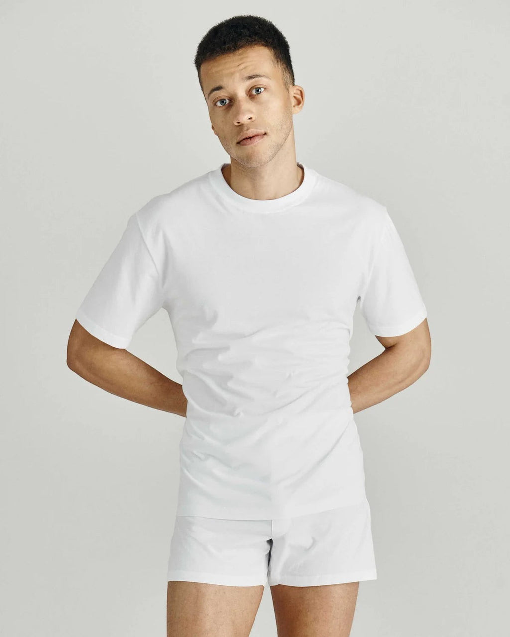 Maison Sarava white cotton crew neck t-shirt with short sleeves on a male model.