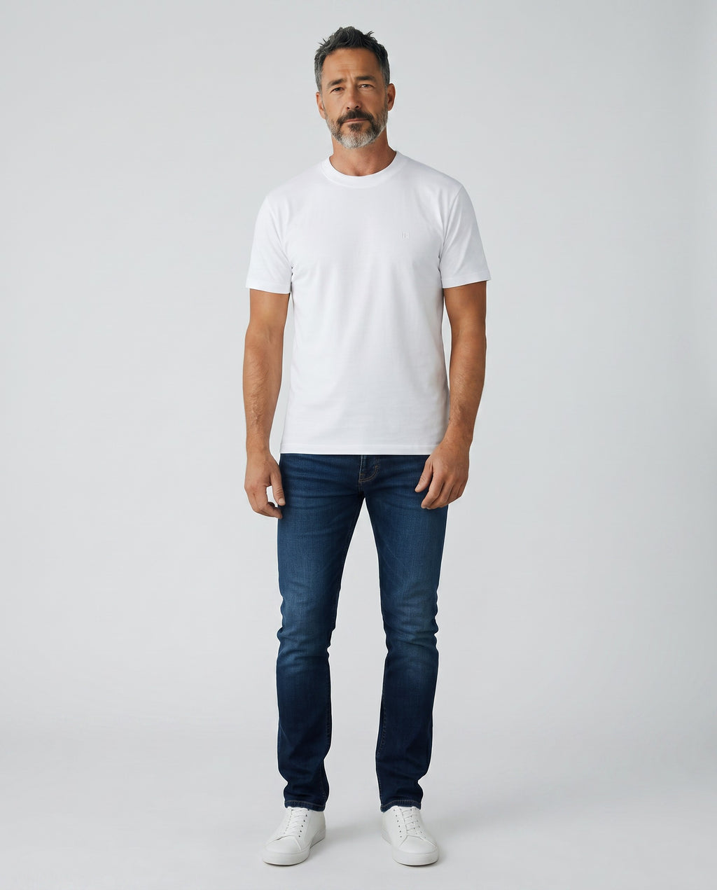 Maison Sarava white textured knit short sleeve crew neck sweater with subtle vertical texture and embroidered logo.
