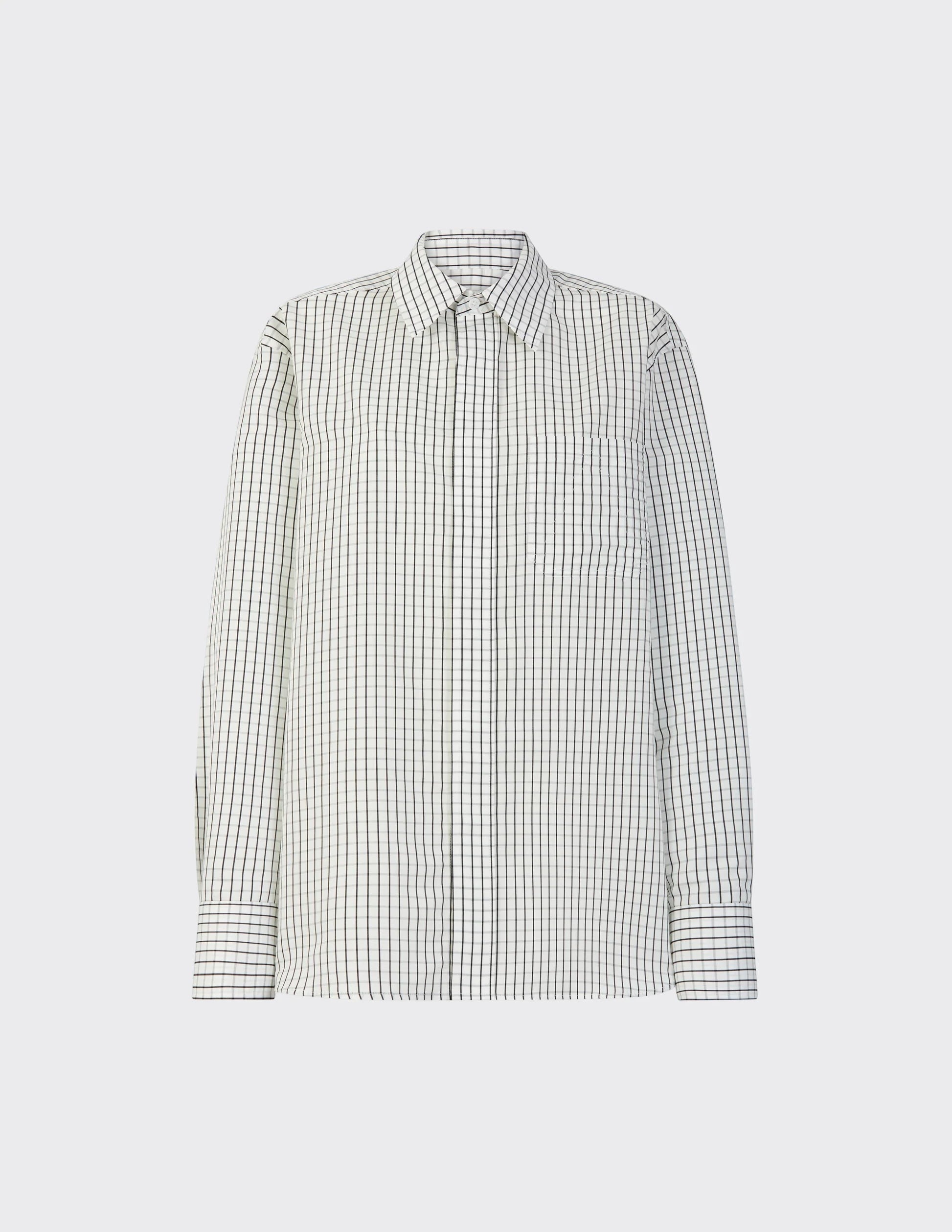 Maison Sarava women's white and black checked oversized shirt with pointed collar, long sleeves, and button cuffs.