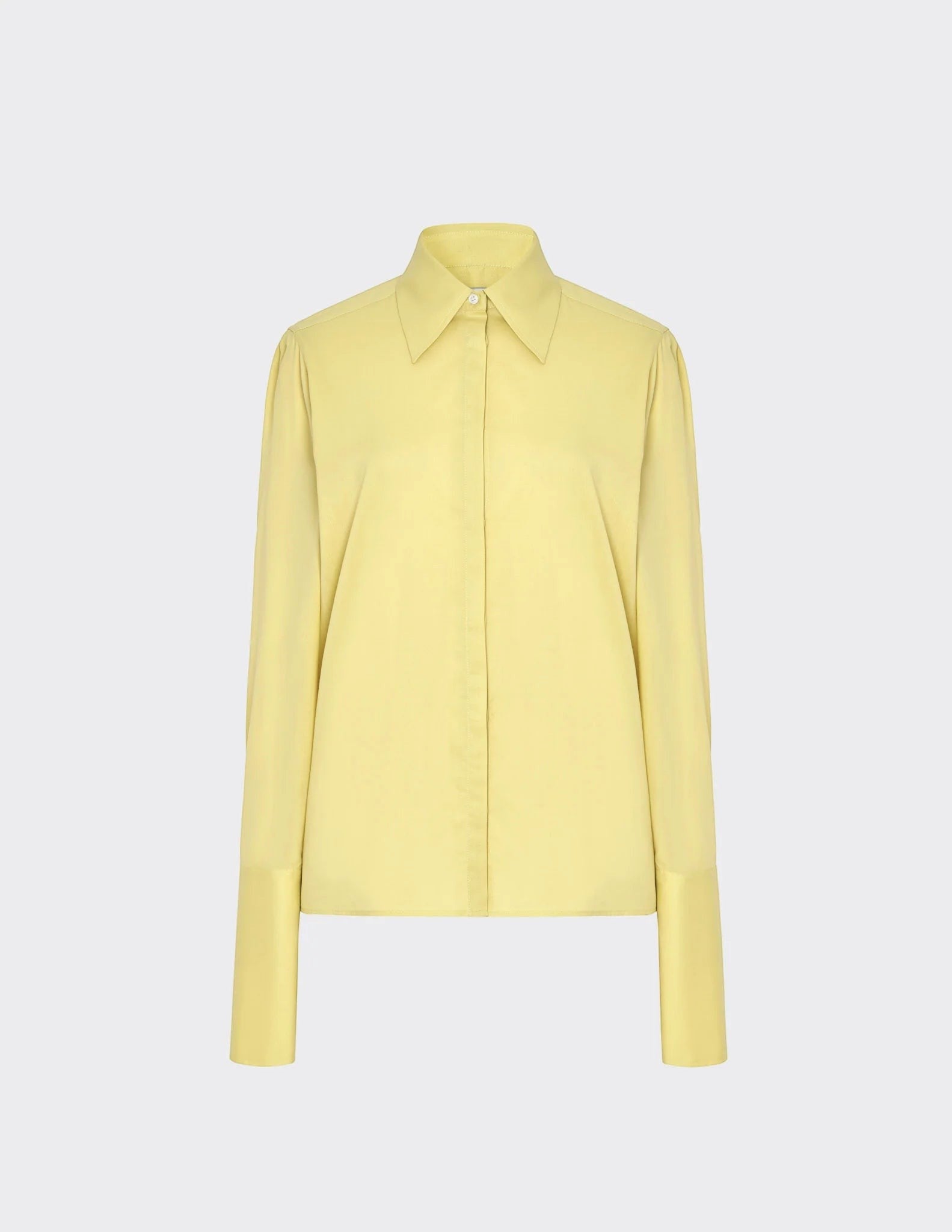 Maison Sarava women's fitted pale yellow long-sleeve shirt with pointed collar and buttoned cuffs.