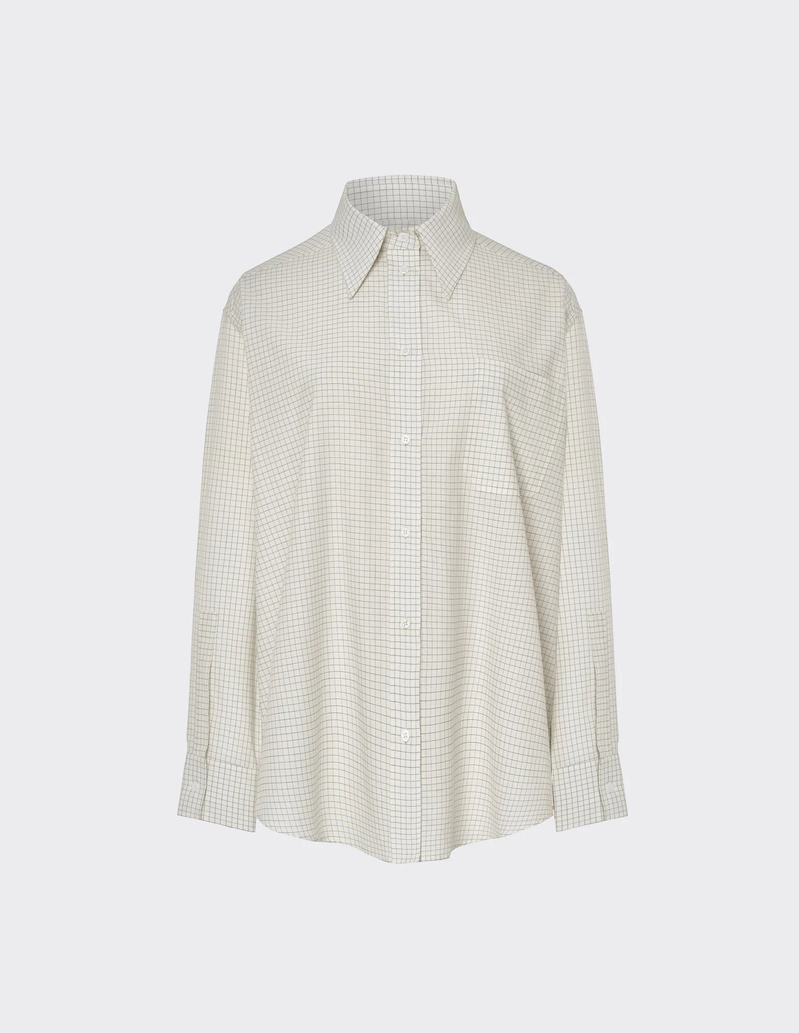 Maison Sarava women's oversized cream and black checkered long-sleeve shirt with pointed collar and button front.